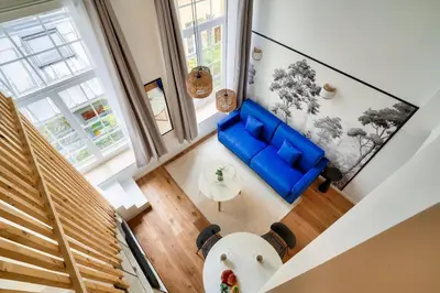 Coin salon dans l'établissement Perchoir Parisien - Dupleix avec mezzanine pour 4