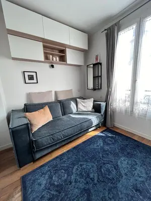 Un ou plusieurs lits dans un hébergement de l'établissement Charmant studio Paris 5e