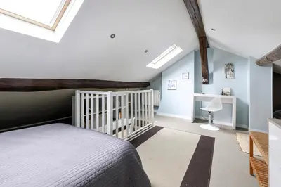 Un ou plusieurs lits dans un hébergement de l'établissement Paris - Cosy Duplex près des Champs Elysées