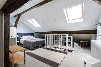 Un ou plusieurs lits dans un hébergement de l'établissement Paris - Cosy Duplex près des Champs Elysées