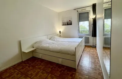 Un ou plusieurs lits dans un hébergement de l'établissement Chambre privée chez l'habitant - Parking Métro - Paris Porte de Versailles