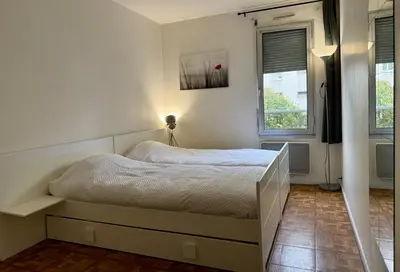 Un ou plusieurs lits dans un hébergement de l'établissement Chambre privée chez l'habitant - Parking Métro - Paris Porte de Versailles