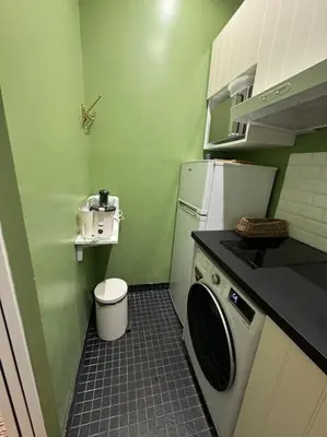 Cuisine ou kitchenette dans l'établissement Appartement au cœur de Paris