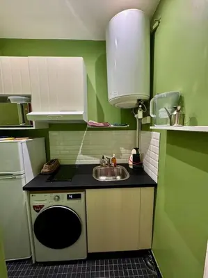 Cuisine ou kitchenette dans l'établissement Appartement au cœur de Paris