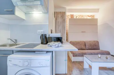 Cuisine ou kitchenette dans l'établissement Le studio Duret II