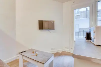 Télévision ou salle de divertissement dans l'établissement Le studio Duret II