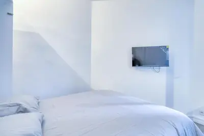 Un ou plusieurs lits dans un hébergement de l'établissement Le studio Duret II