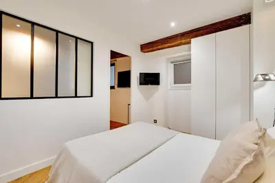 Un ou plusieurs lits dans un hébergement de l'établissement Charming apartment - 1BR-4P - Les Halles