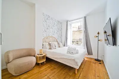 Un ou plusieurs lits dans un hébergement de l'établissement Magnifique appartement parisien