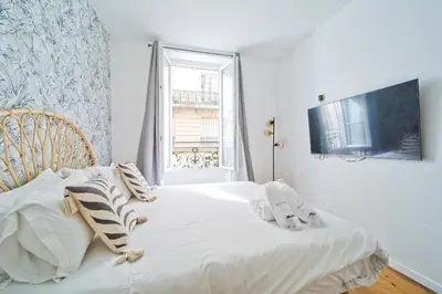 Un ou plusieurs lits dans un hébergement de l'établissement Magnifique appartement parisien