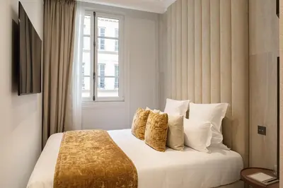Un ou plusieurs lits dans un hébergement de l'établissement TheLander - Serviced Apartments in Opéra