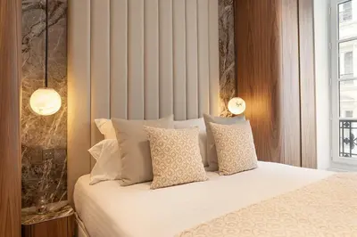 Un ou plusieurs lits dans un hébergement de l'établissement TheLander - Serviced Apartments in Opéra