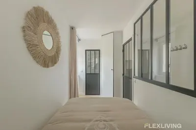 Un ou plusieurs lits dans un hébergement de l'établissement Flexliving - studio - Guénot