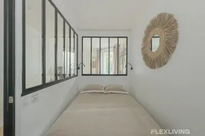 Un ou plusieurs lits dans un hébergement de l'établissement Flexliving - studio - Guénot