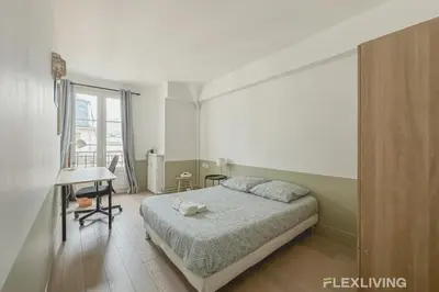 Un ou plusieurs lits dans un hébergement de l'établissement Flexliving - room - Batelière