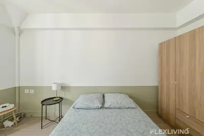 Un ou plusieurs lits dans un hébergement de l'établissement Flexliving - room - Batelière