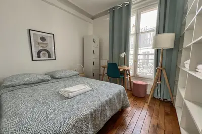 Un ou plusieurs lits dans un hébergement de l'établissement Flexliving - whole flat - Voltaire