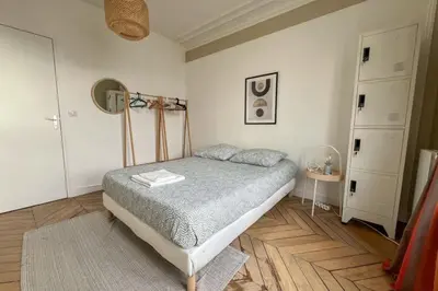 Un ou plusieurs lits dans un hébergement de l'établissement Flexliving - whole flat - Voltaire