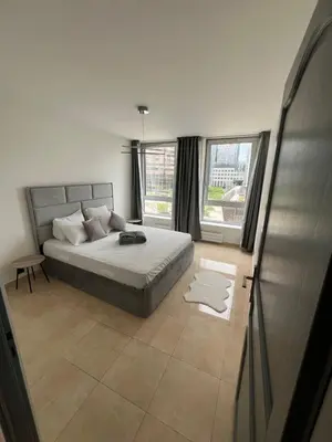 Un ou plusieurs lits dans un hébergement de l'établissement Paris La Défense - appart 3 chambre
