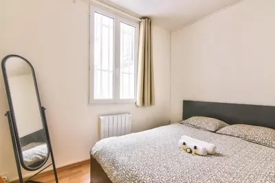 Un ou plusieurs lits dans un hébergement de l'établissement GuestReady - Cosy Apartment in Le Marais