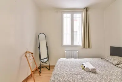 Un ou plusieurs lits dans un hébergement de l'établissement GuestReady - Cosy Apartment in Le Marais