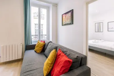 Un ou plusieurs lits dans un hébergement de l'établissement GuestReady - Cosy Apartment in Le Marais