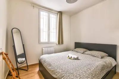 Un ou plusieurs lits dans un hébergement de l'établissement GuestReady - Cosy Apartment in Le Marais