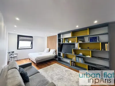 Coin salon dans l'établissement Urban Flat 168 - Spacious 1-Bedroom Apartment in Paris