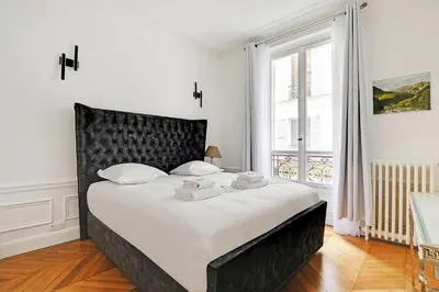 Un ou plusieurs lits dans un hébergement de l'établissement Dazzling flat - 3BD8P - Arc de Triomphe
