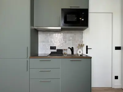 Cuisine ou kitchenette dans l'établissement Celine 25 Appartement Bien Équipé dans un Quartier Prisé
