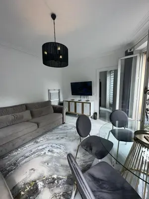 Coin salon dans l'établissement Appartement parisien