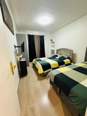Un ou plusieurs lits dans un hébergement de l'établissement Appartement parisien
