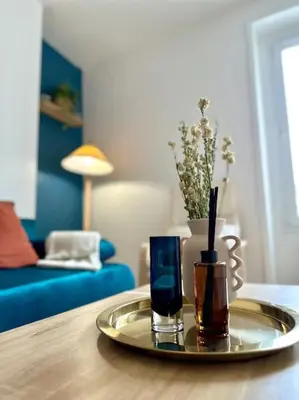 Coin salon dans l'établissement Celine 3 La perle Bleue - appartement cosy à La Défense