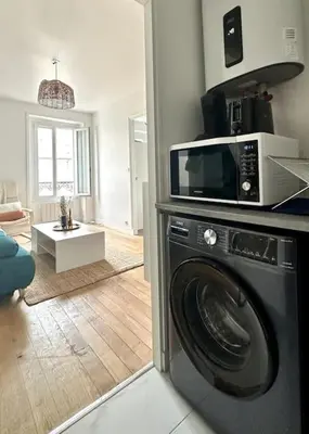 Cuisine ou kitchenette dans l'établissement Celine 3 La perle Bleue - appartement cosy à La Défense