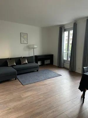 Coin salon dans l'établissement Appartement Paris 16