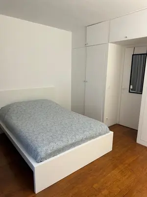 Un ou plusieurs lits dans un hébergement de l'établissement Appartement Paris 16