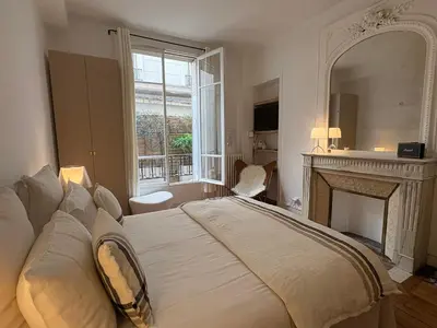 Un ou plusieurs lits dans un hébergement de l'établissement Comme une maison à deux pas de l'Arc de Triomphe