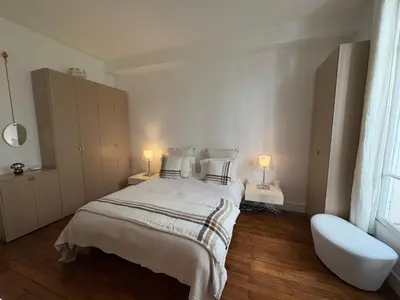 Un ou plusieurs lits dans un hébergement de l'établissement Comme une maison à deux pas de l'Arc de Triomphe
