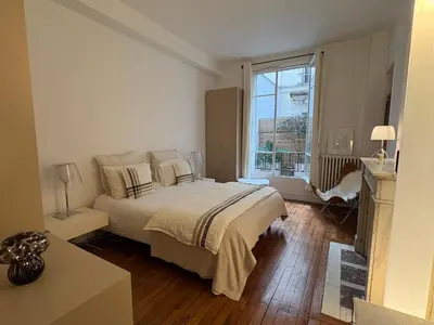 Un ou plusieurs lits dans un hébergement de l'établissement Comme une maison à deux pas de l'Arc de Triomphe