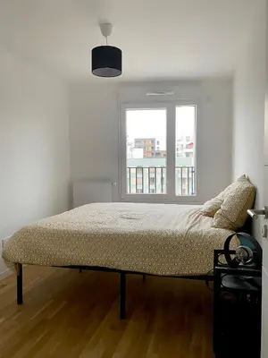 Un ou plusieurs lits dans un hébergement de l'établissement 3 pièces tout neuf de haut standing à 10mn de Paris avec terrasse vue Sacré Coeur