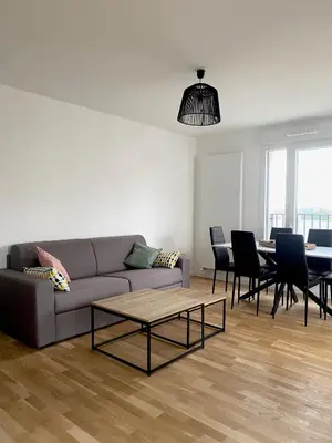 Coin salon dans l'établissement 3 pièces tout neuf de haut standing à 10mn de Paris avec terrasse vue Sacré Coeur
