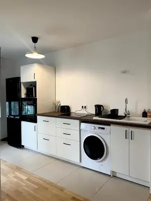 Cuisine ou kitchenette dans l'établissement 3 pièces tout neuf de haut standing à 10mn de Paris avec terrasse vue Sacré Coeur