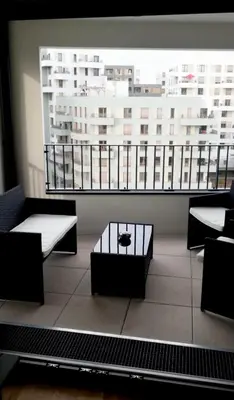 Coin salon dans l'établissement 3 pièces tout neuf de haut standing à 10mn de Paris avec terrasse vue Sacré Coeur