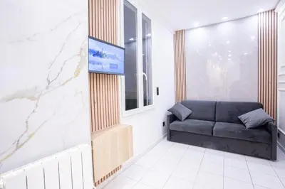 Coin salon dans l'établissement Appartement Royal carré d'or de Paris 17 eme