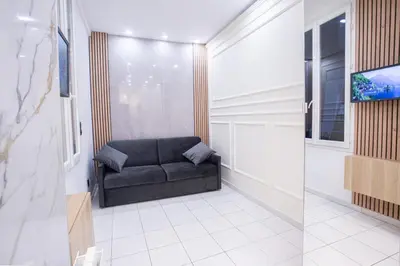 Coin salon dans l'établissement Appartement Royal carré d'or de Paris 17 eme