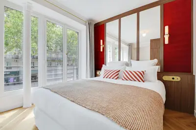Un ou plusieurs lits dans un hébergement de l'établissement ONIRI - Serviced Apartment in Saint Germain