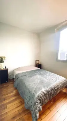 Un ou plusieurs lits dans un hébergement de l'établissement 3 pièces lumineux paris Montmartre