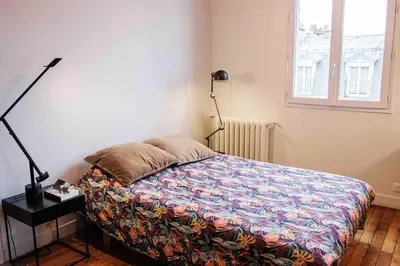 Un ou plusieurs lits dans un hébergement de l'établissement 3 pièces lumineux paris Montmartre