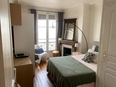 Un ou plusieurs lits dans un hébergement de l'établissement Nice and cosy apartment Ménilmontant