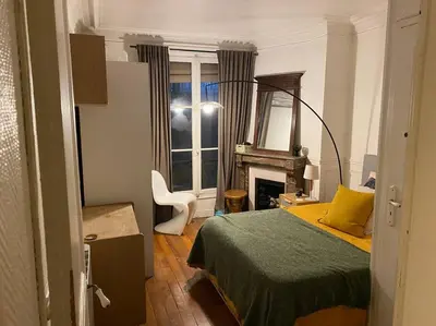Un ou plusieurs lits dans un hébergement de l'établissement Nice and cosy apartment Ménilmontant